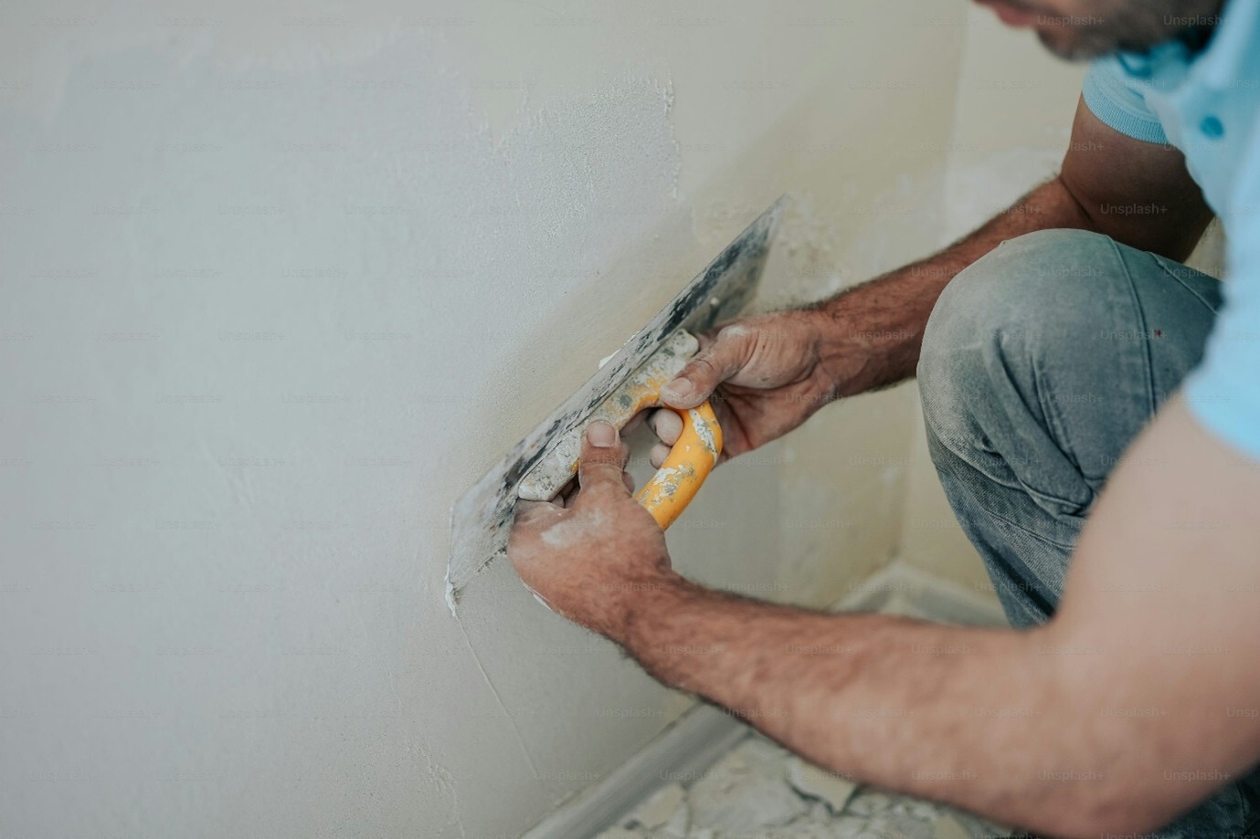 Man plastering with a trowel
